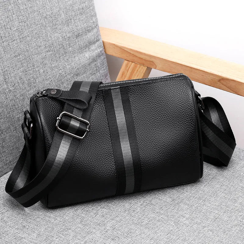 Black genuine leather women's crossbody bag with one shoulder strap showing large capacity dimensions