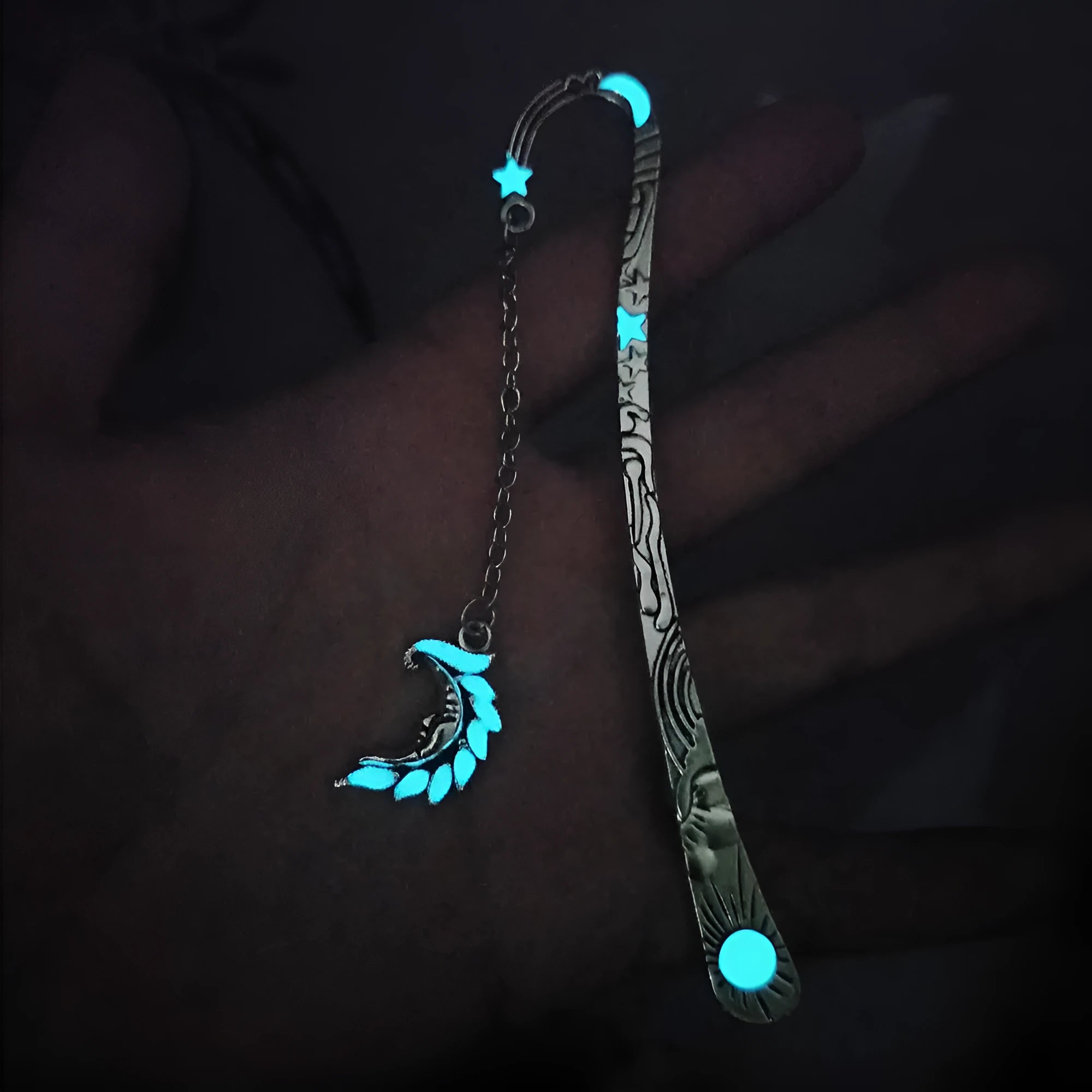 Retro five-pointed star glowing metal bookmark in ancient silver and bronze colours with celestial patterns