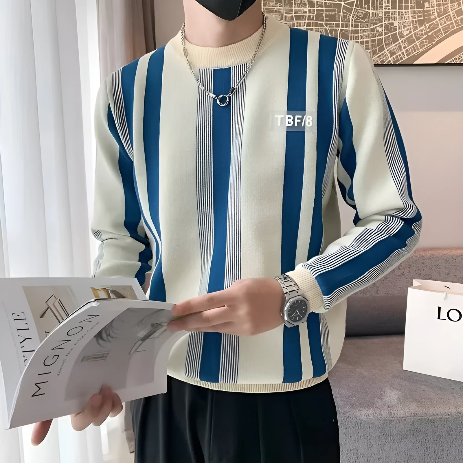 Blue and white contrast stripe long-sleeved pullover sweater, loose fit knitwear with V-neck.