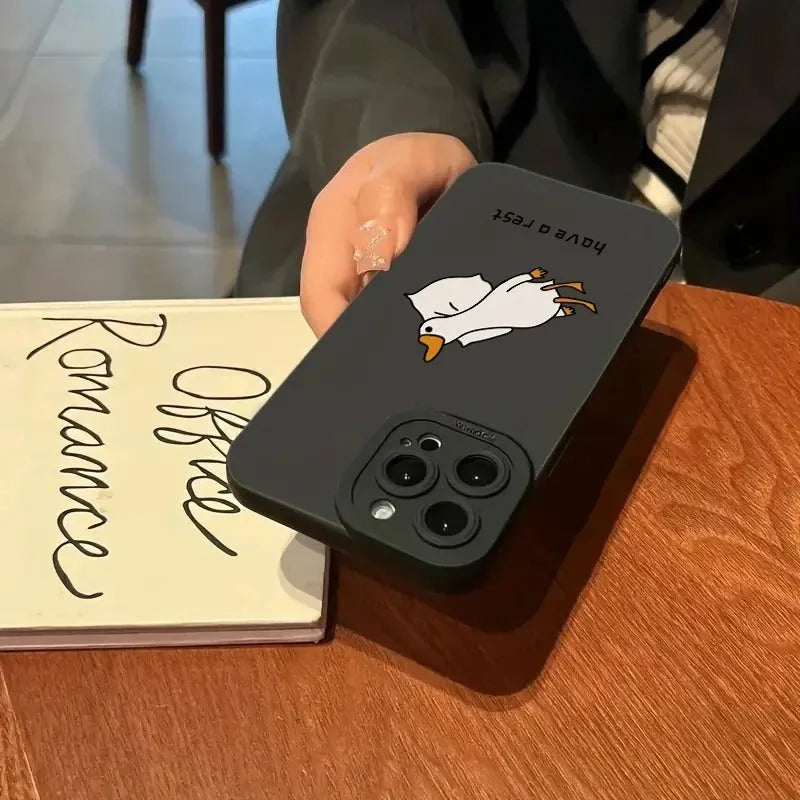 Black silicone iPhone case with a carved cartoon duck design on the back