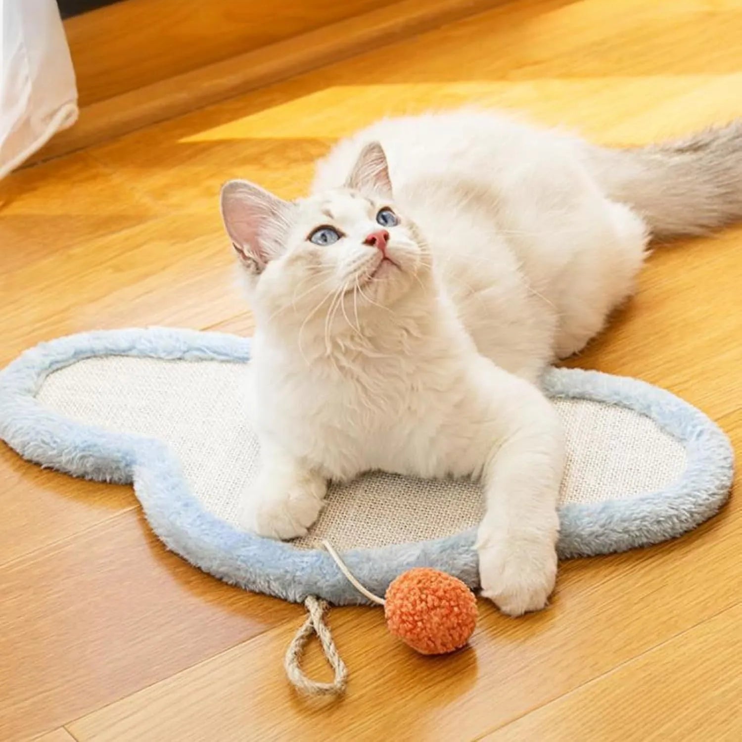 White sleeping cat pattern sisal scratching mat mounted on wall with curved design