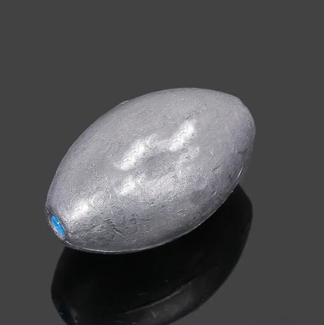 Olive coloured rugby-shaped fishing sinker with scale pattern, showing 10g to 150g weight options