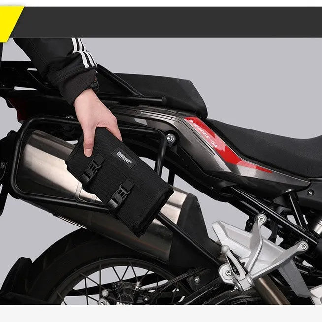 Motorcycle tool storage roll unfolded showing 8 elastic straps and mesh zipper pouch in black polyester fabric