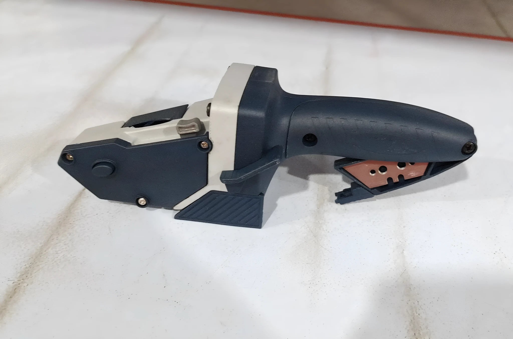 Blue aluminium alloy and TPR plastic woodworking cutter tool with measuring scale.