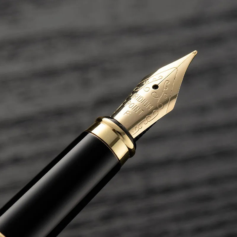 Metal fountain pen with gold clip for calligraphy practice and writing