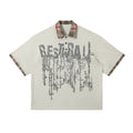 Men's loose asymmetric short-sleeved top with graffiti print on lapels in residual blue colour
