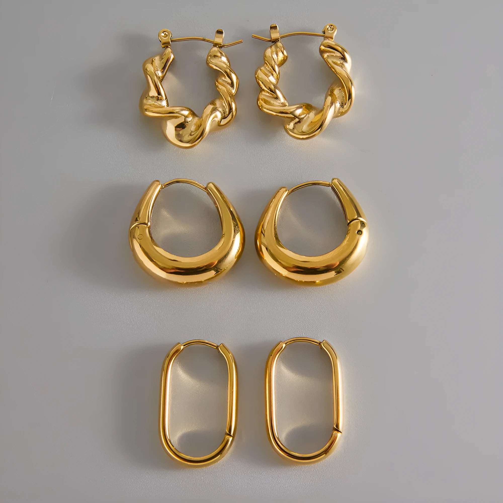 18K gold titanium steel clip-on earrings, geometric ellipse shape, light luxury design, stainless steel with electroplated finish