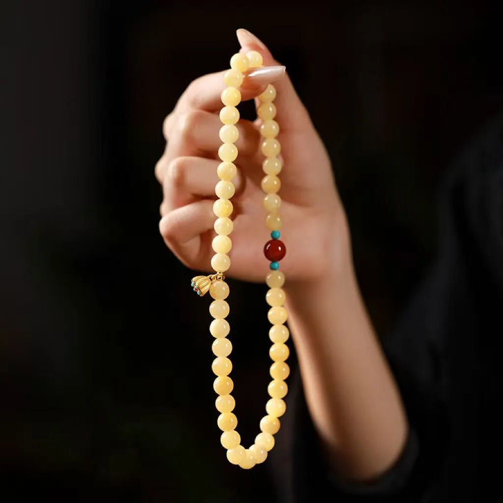 Yellow jade handmade double ring bracelet showing hand-woven texture and retro style