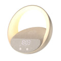 Beige multifunctional Bluetooth speaker with wireless charging pad, LED light, and digital clock display on wooden surface