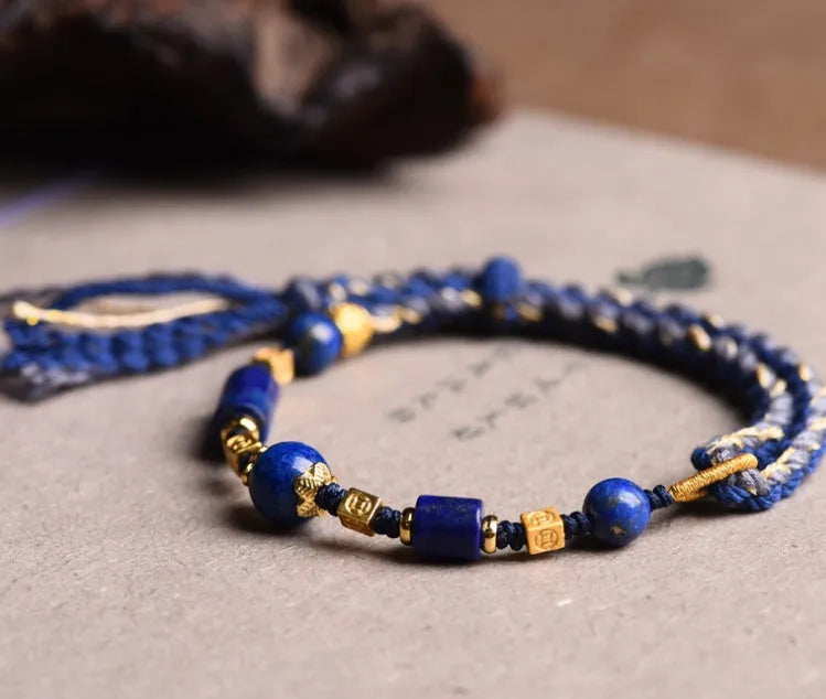 Hand-woven ethnic watch bracelet in flexible wire, showing Hongfei Ebony and Lapis Lazuli colour options.