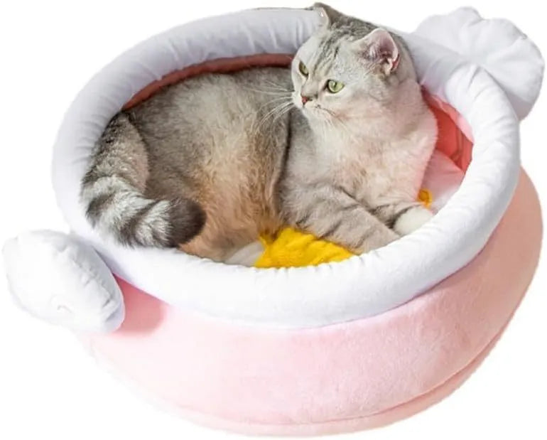 A pink magic honey pot shaped cat sofa bed with a soft interior for a small pet.
