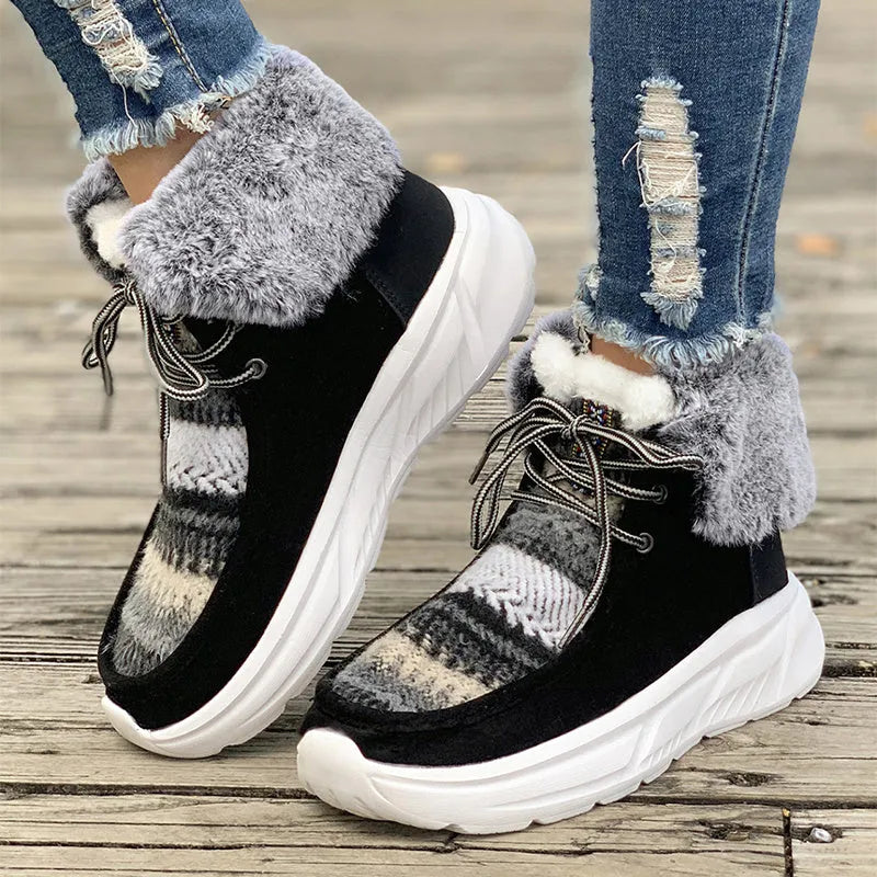Women's beige lace-up snow boots with suede upper, thick rubber sole, and fuzzy lining.