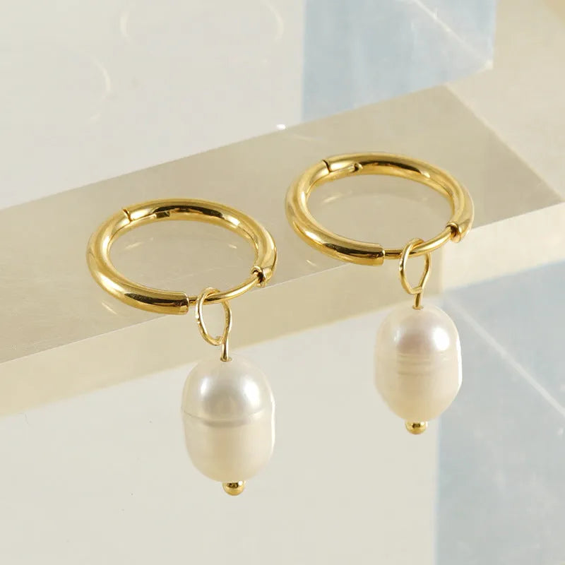 Gold coloured geometric women's earrings with a freshwater pearl, made from stainless steel and titanium steel.