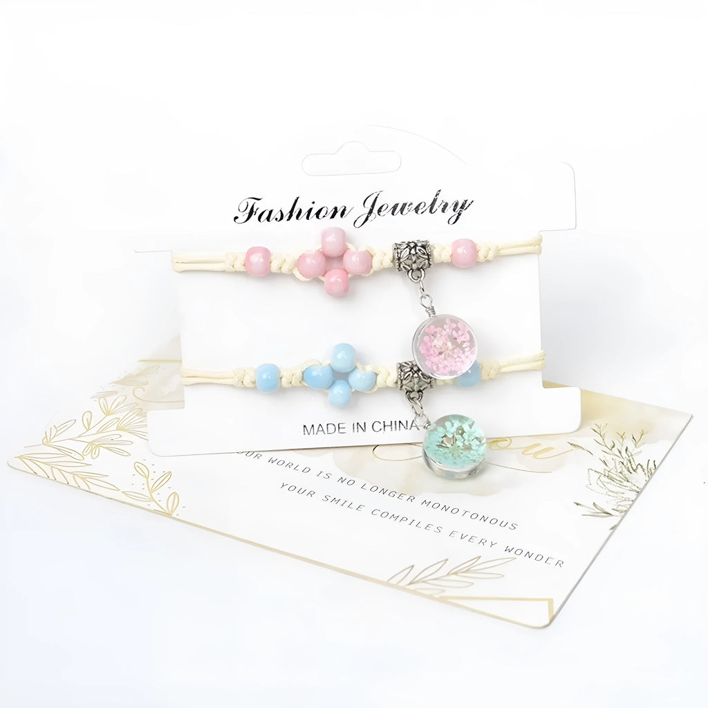 Close-up of a hand-woven glass dried flower bracelet with large colourful beads on a wrist.