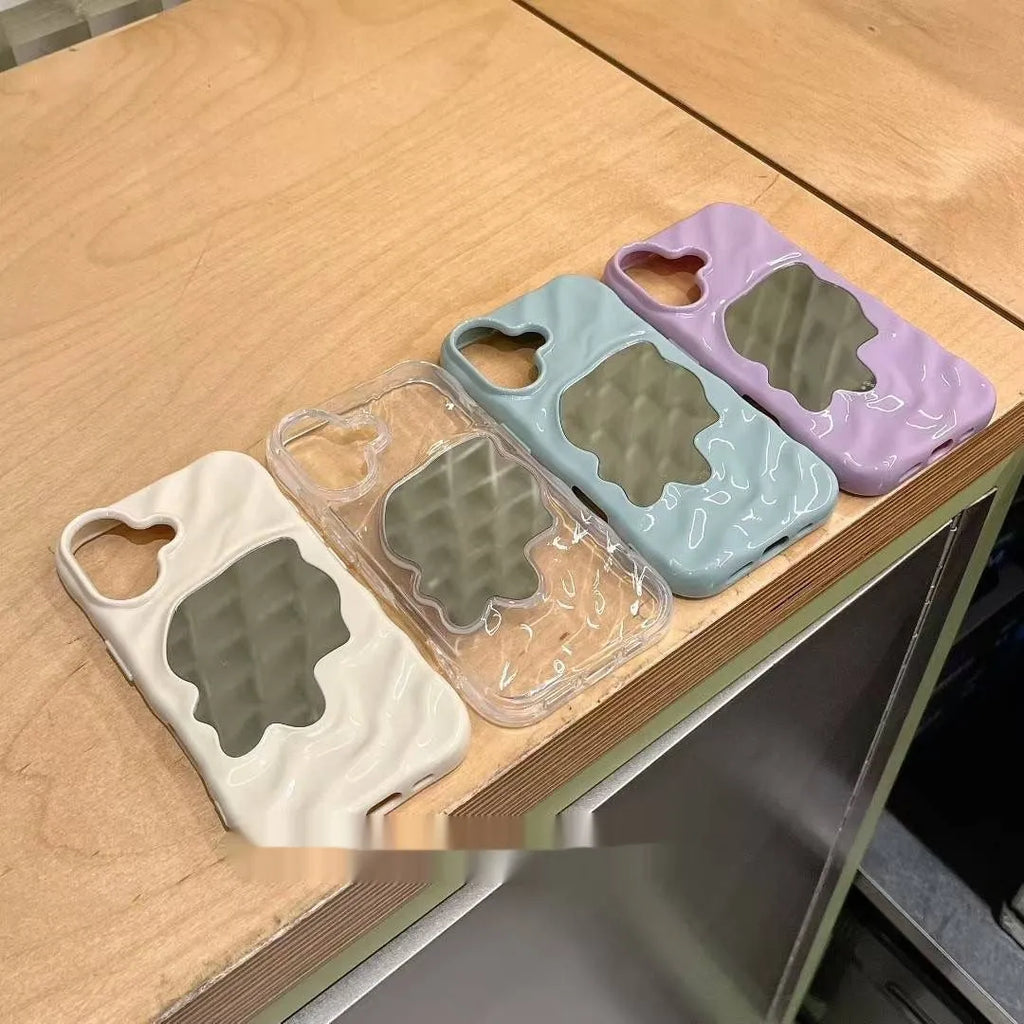 iPhone phone case with water ripple texture and a solid colour mirror back on a table
