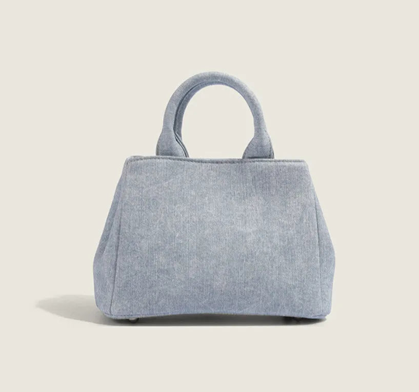 Women's denim blue PU shoulder handbag with polyester lining, standard size