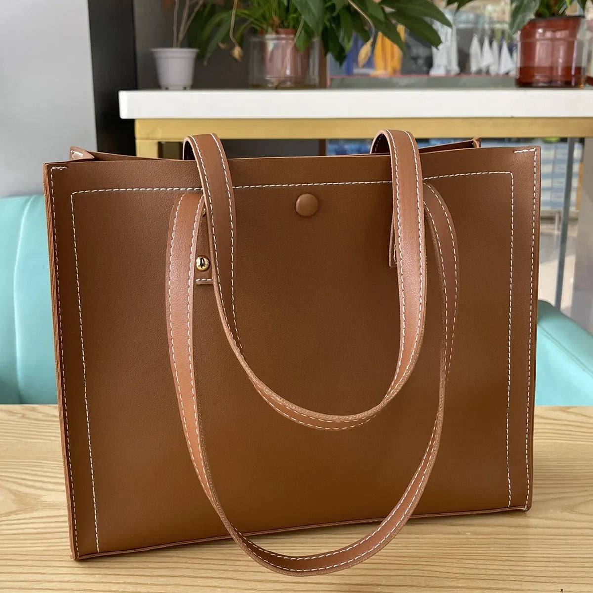 PU embossed crossbody tote bag with contrast colour stitching, horizontal square shape, black and brown option