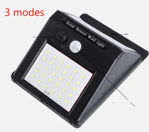 Solar powered outdoor garden lamp with motion sensor and 30 LED lights for automatic pathway illumination