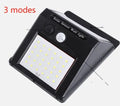 Solar powered outdoor garden lamp with motion sensor and 30 LED lights for automatic pathway illumination