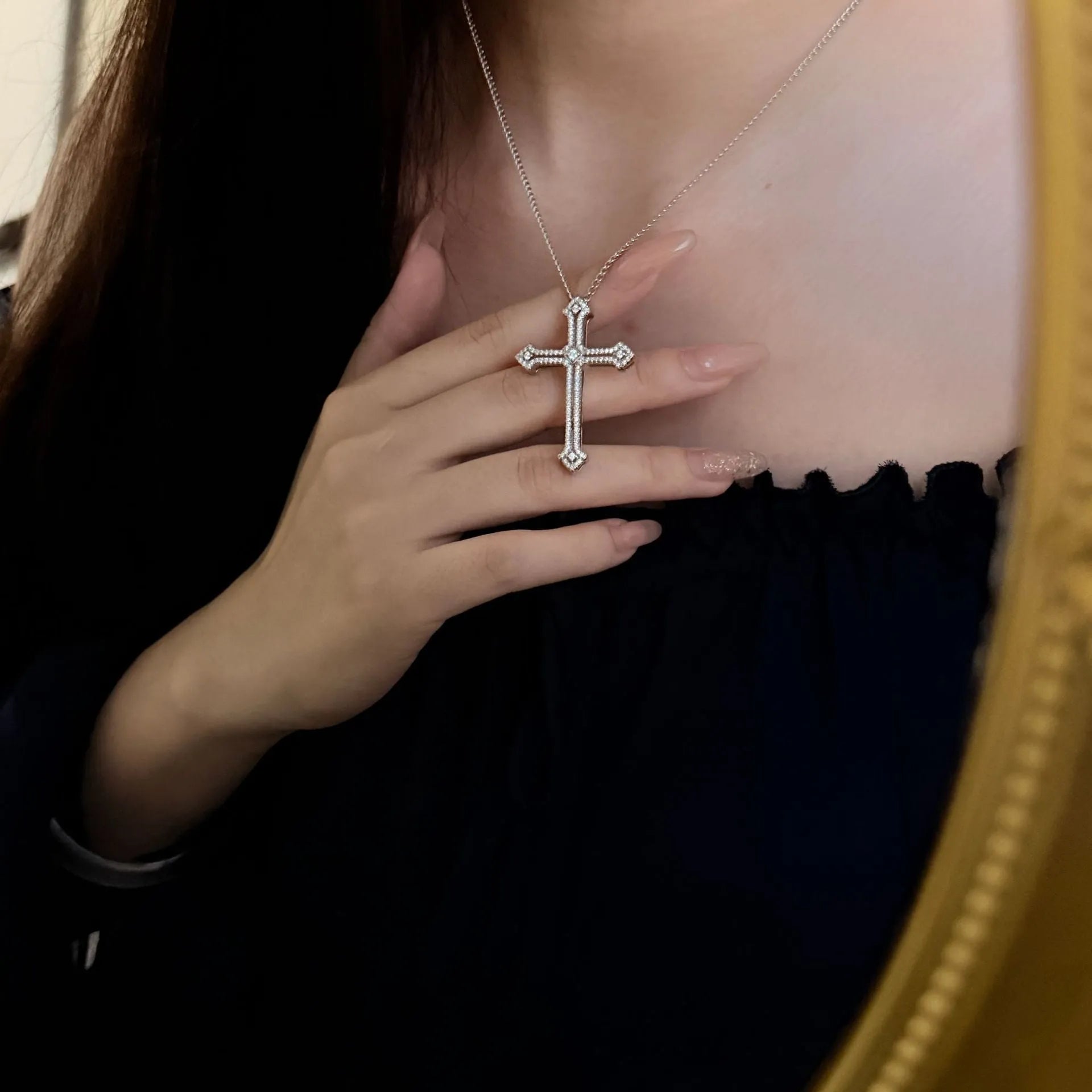 Copper geometric cross necklace with electroplated finish on women's neck