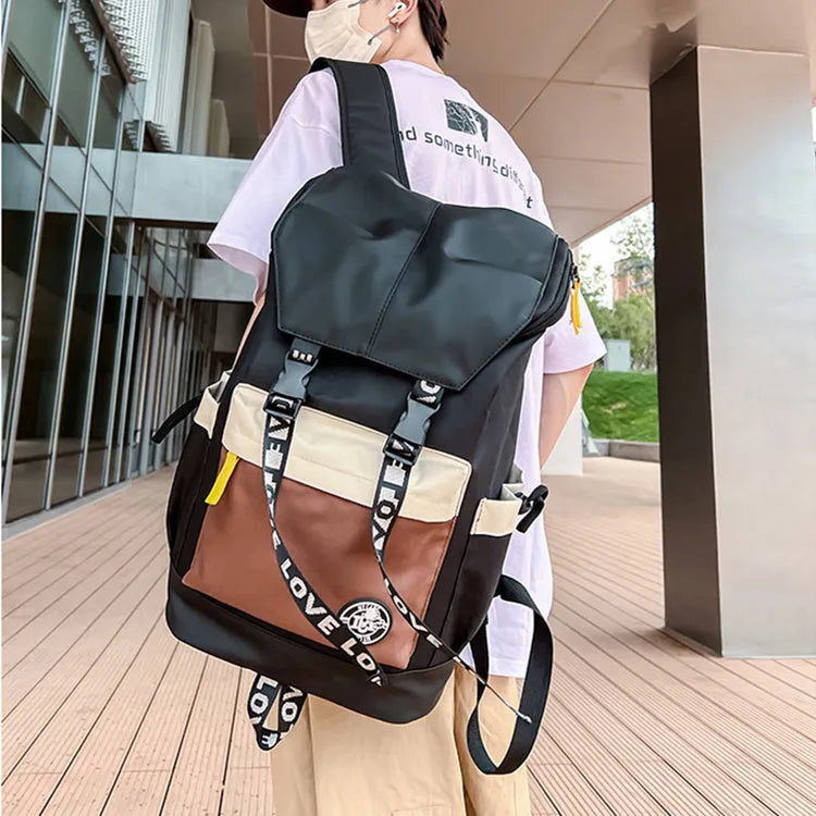 Oxford cloth backpack in black, green, or red colours showing handheld and shoulder straps.