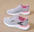 Women's low top casual running shoes in beige with mesh upper, lace-up front, round toe, and soft PVC sole