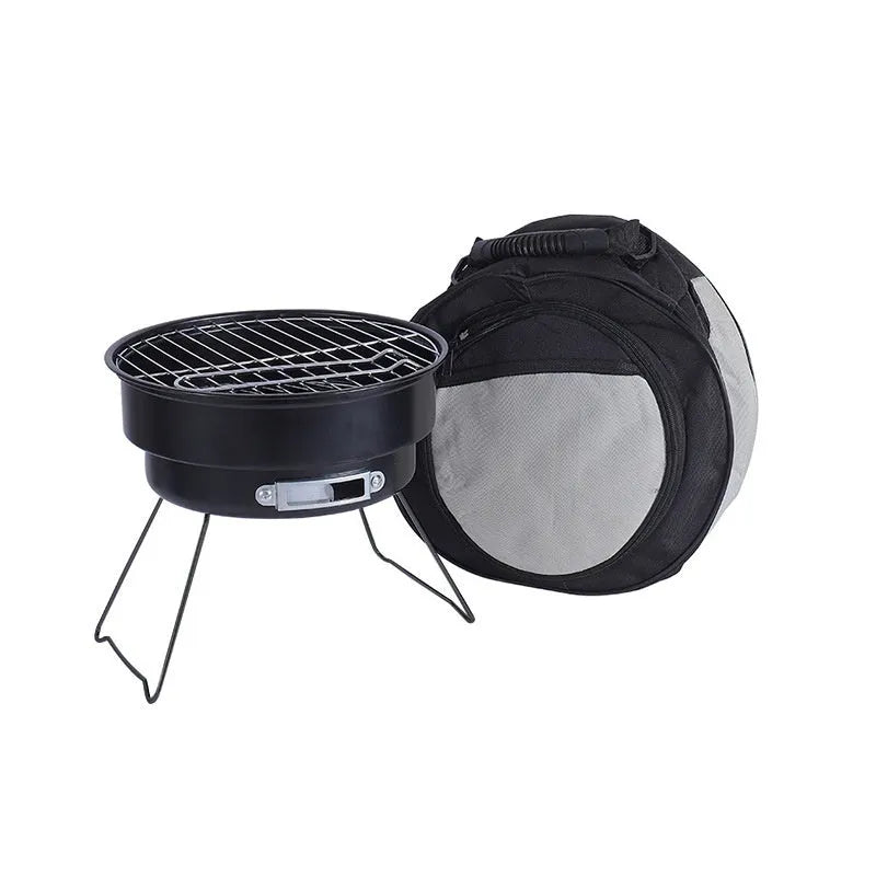 Small folding round metal ice stove with grill mesh, leg, and storage bag for portable barbecues.