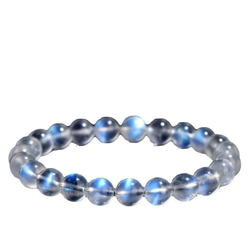 Natural cream body blue moonlight crystal bracelet with grinding finished beads on wrist