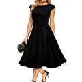 Sleeveless black dress with lace-up waist and oversized swing skirt midi length