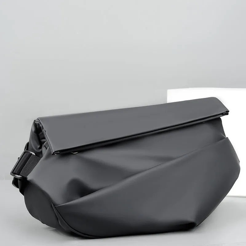 Grey men's crossbody sling bag made of PU leather with a zip opening and shoulder strap.