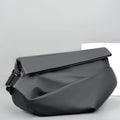 Grey men's crossbody sling bag made of PU leather with a zip opening and shoulder strap.