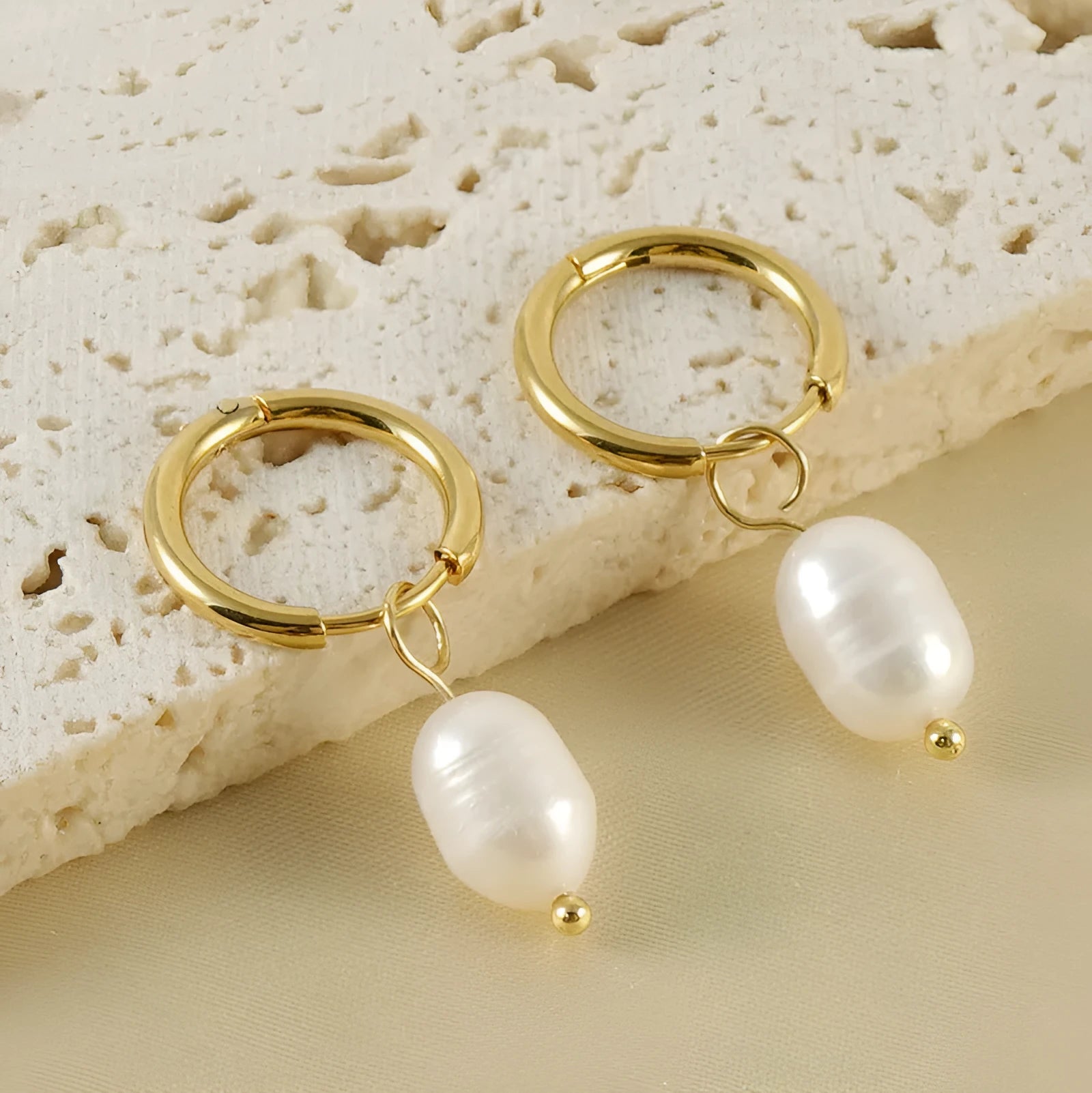 Gold coloured geometric women's earrings with a freshwater pearl, made from stainless steel and titanium steel.