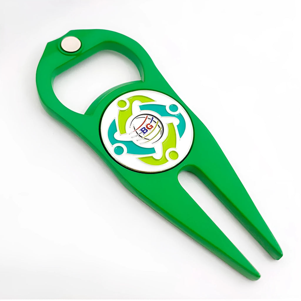 Black zinc alloy golf ball yoke bottle opener tool on a putting green.