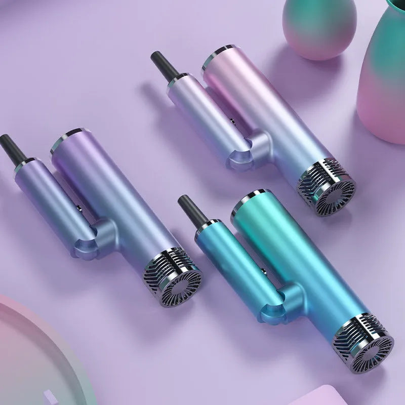 Green foldable hair dryer with collapsed handle next to a suitcase.