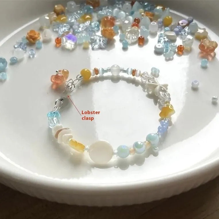 Orange gold-tone bracelet with water-soaked texture, diamond shape and round decorative elements