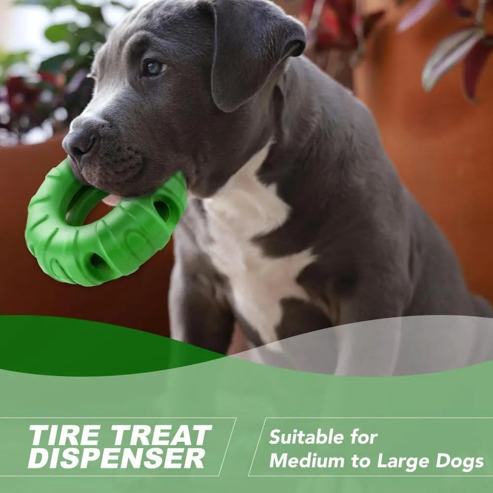 Blue rubber tyre-shaped dog chew toy with oval openings for slow feeding.