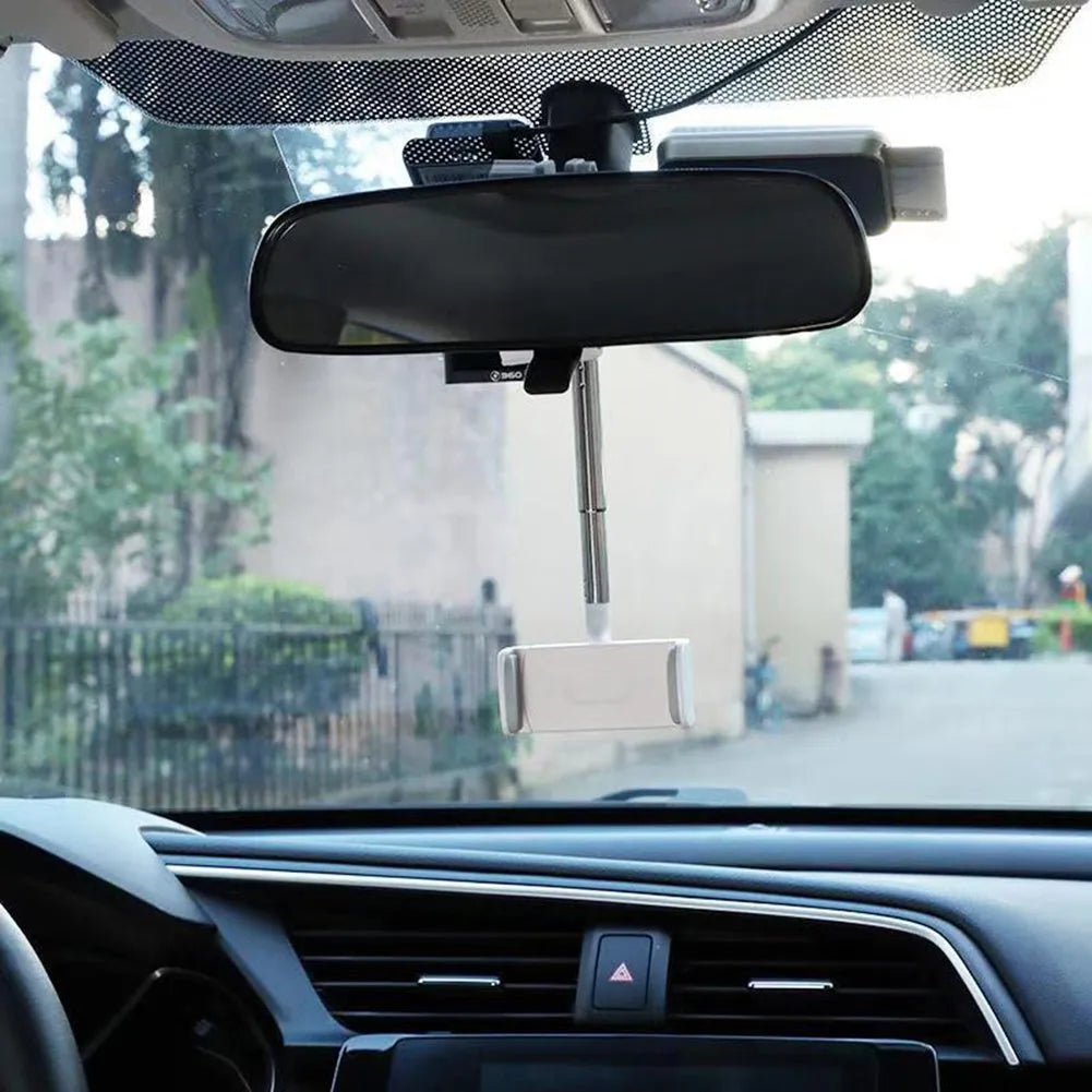Black car phone holder mounted with 360-degree rotation adjustment mechanism visible