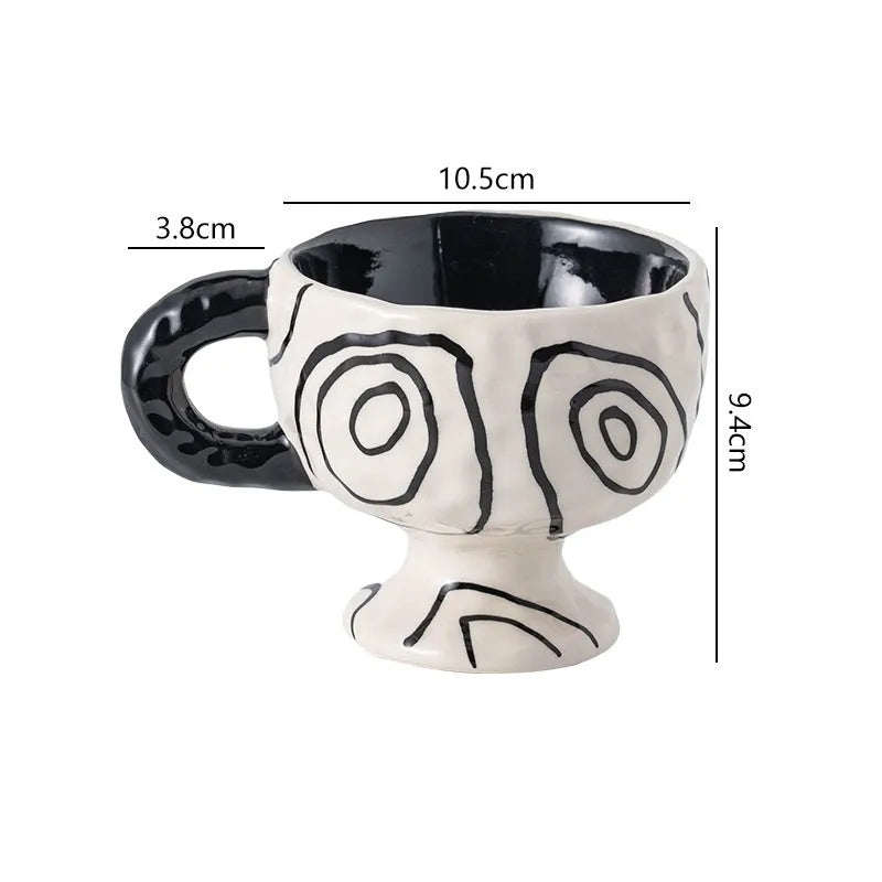 Hand-pinched irregular shaped ceramic mug in a solid colour, showing its unique handmade form.
