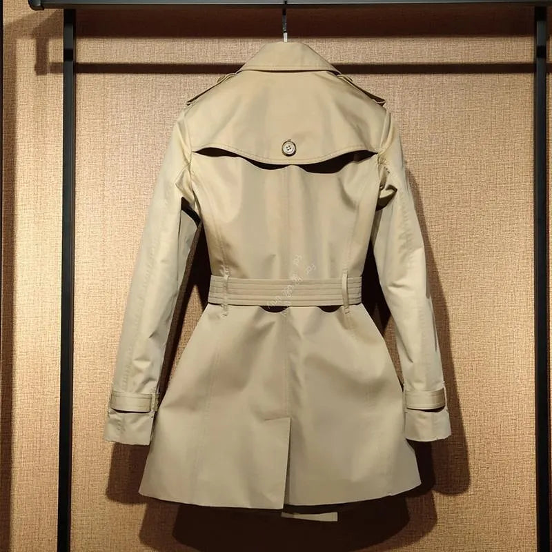 Khaki women's double-breasted polyester trench coat with flight sleeves on a hanger