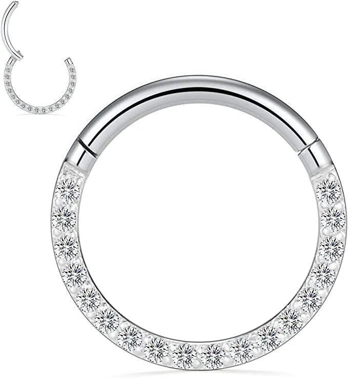 A stainless steel seamless nose ring with a diamond setting, shown in gold, rose gold, black, and steel finishes.
