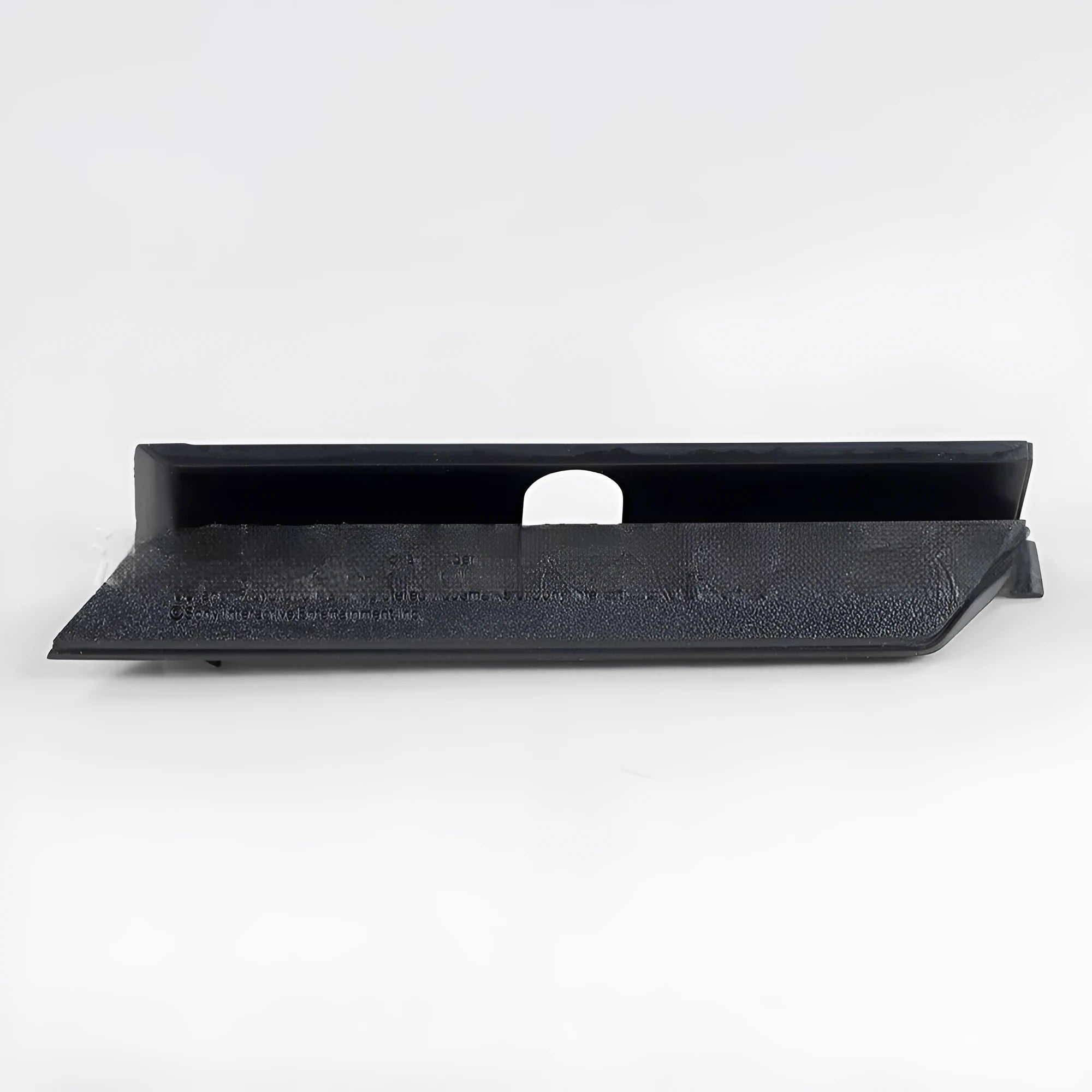 A black plastic hard drive bay cover for a 3.5-inch slot, shown alongside a white version.