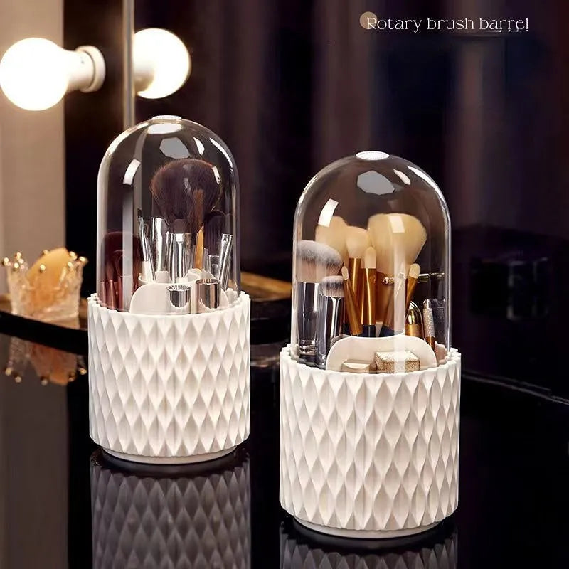 White rotating makeup brush storage holder with transparent lid on desktop