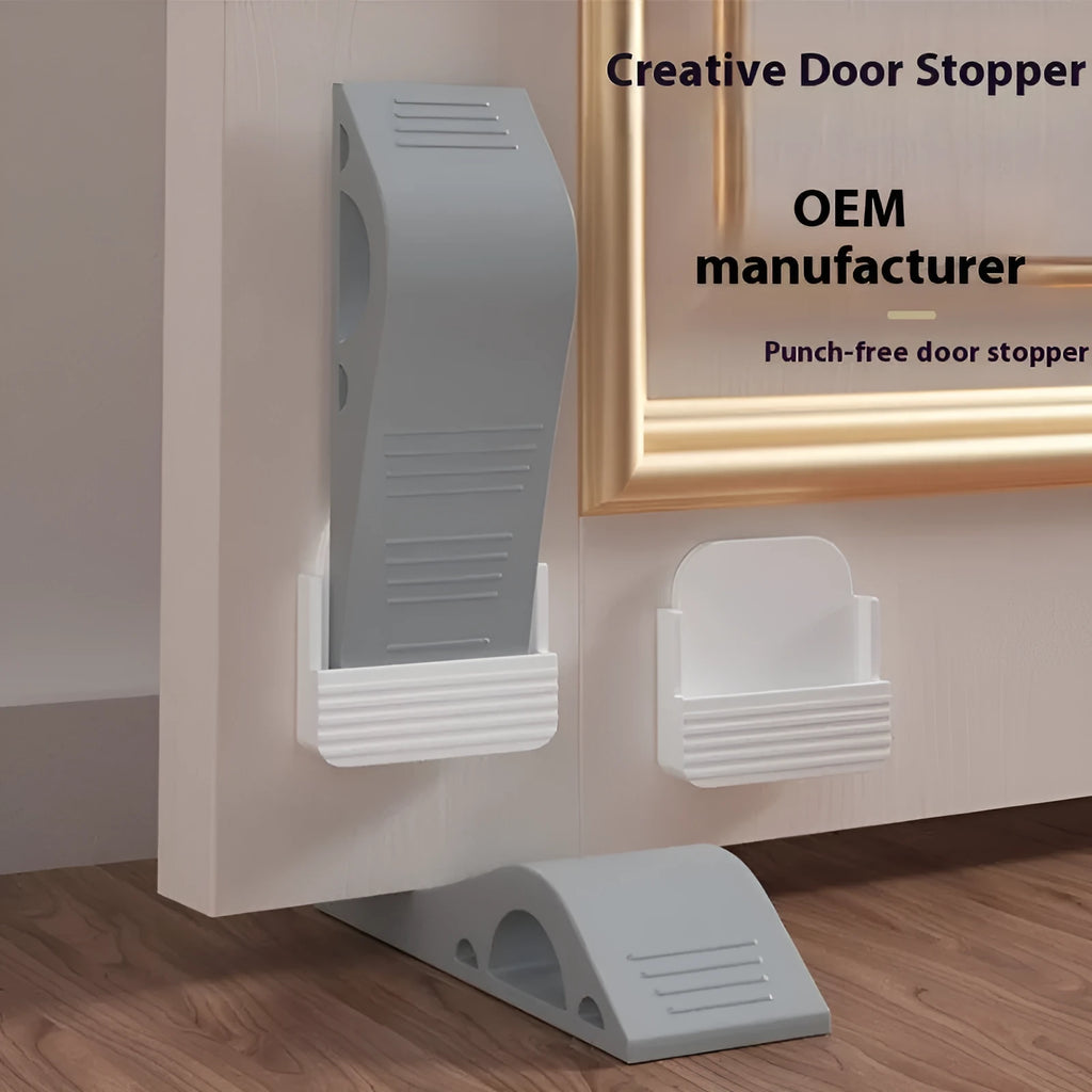 Gray rubber arch-shaped door stopper with a non-slip base on a light floor surface