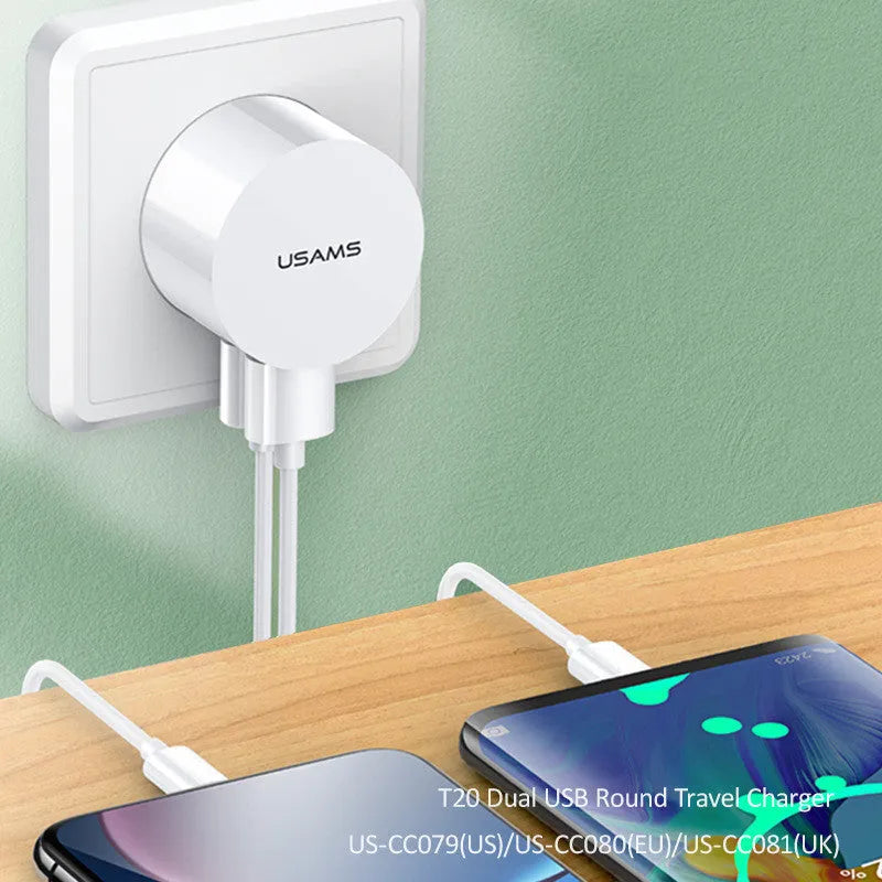 White portable dual USB charger with folding UK, US, and EU plugs showing compact dimensions