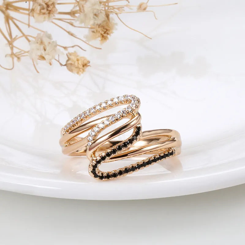 Close-up of a women's copper ring with micro-inlaid zircon stones and an electroplated finish.