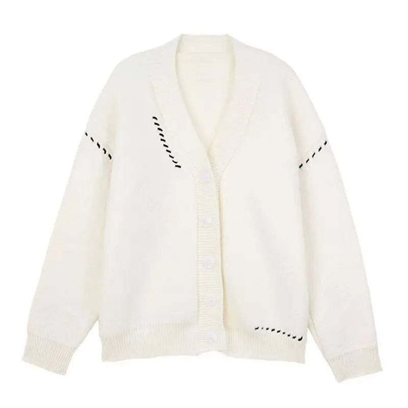 Women's loose-fit knitted cardigan coat in black, shown as a long-sleeve layering piece.