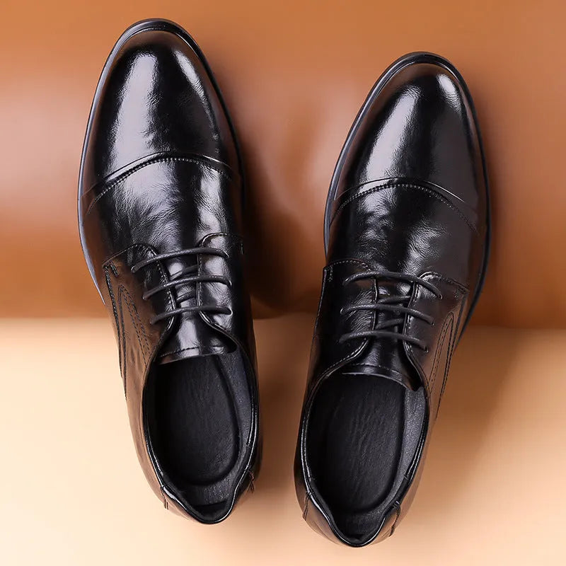 Men's business formal leather shoes in black with cow split leather upper, pointed toe, and tassel detail