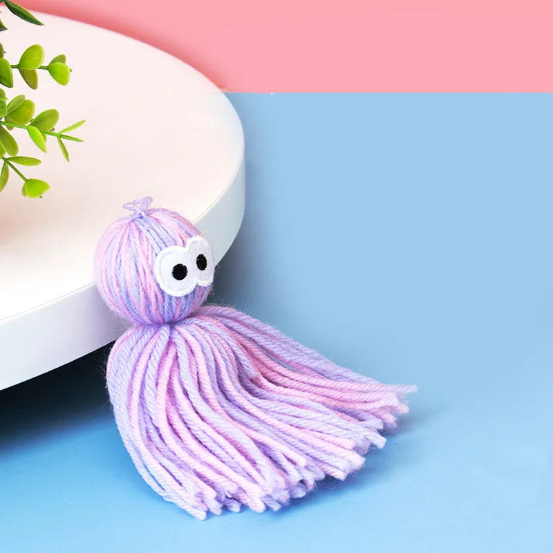 Wool ball cat toy with hanging loop and teaser stick in blue grey colour