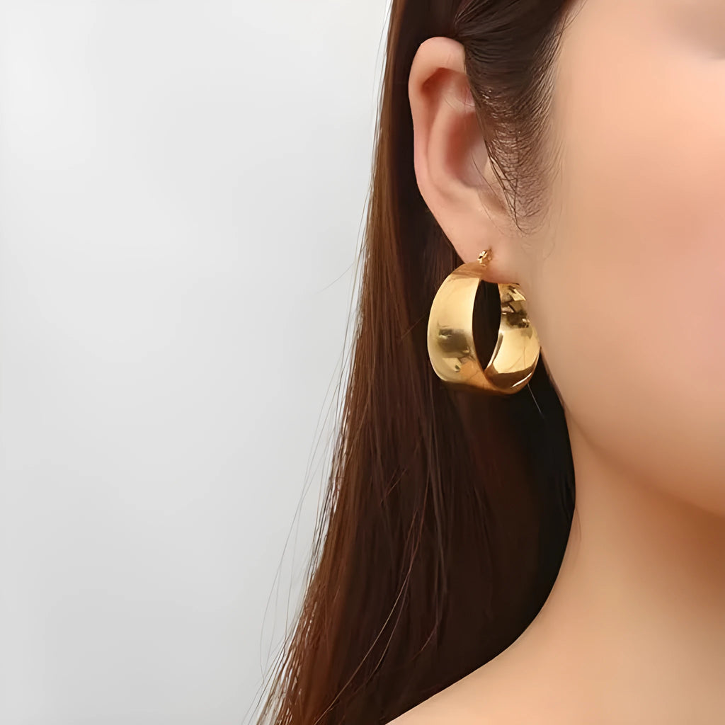 Stainless steel widened curved earrings in gold or steel colour, 25mm or 30mm sizes