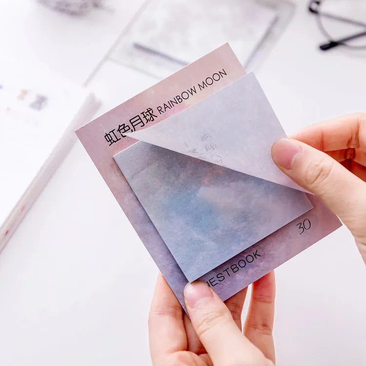 Square planet sticky notes pad showing oil painting designs of Earth, Mars, and moons at 7.3cm size.